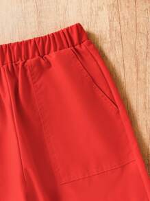 Pantalones anchos casuales y sueltos para niñas preadolescentes con cintura elástica y bolsillos de cargo de un solo color