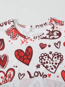 Conjunto de 3 piezas para niñas preadolescentes con: top corto de manga larga con estampado de corazones graffiti, camiseta sin mangas de unicolor y pantalón cargo para Día de San Valentín