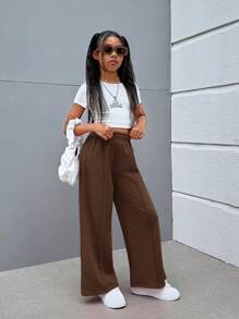 SHEIN Spodnie w jednolitym kolorze z dzianiny w stylu ulicznym dla dziewcząt w wieku od 1 do 2 lat