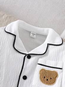 SHEIN Young Boy Simple Casual Cute Bear Patched Pocket Turndown Collar Open Front Long Sleeve Knit Jacquard Long Pants 2 Pieces Pajama Set