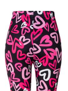 Leggings para niñas preadolescentes, marca Streecool preadolescente, leggings de ajuste ceñido de longitud completa con patrón de corazones en color rosa y negro, diseño elegante y dinámico, adecuado para deportes, escuela, actividades al aire libre y uso en todas las estaciones. Los leggings presentan una combinación de color rosa y negro con un diseño de patrón de corazones de cobertura total