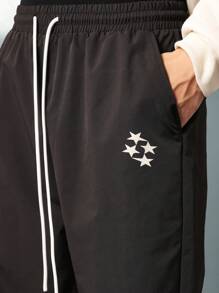 SUMWON Pantalón de nailon con ajuste recto y estampado gráfico