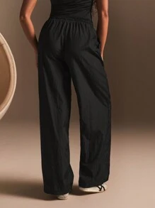 Athîral Pantalón de chándal informal suelto de pierna ancha con bolsillos y cordón en la cintura de color liso para mujeres