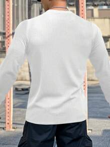 Manfinity Sport Corelite Camiseta deportiva de manga larga de unicolor casual con cuello escotado para hombres, otoño