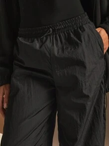 Athîral Pantalón de chándal informal suelto de pierna ancha con bolsillos y cordón en la cintura de color liso para mujeres