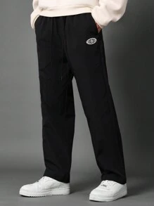 SUMWON 低裆尼龙运动裤，运动休闲慢跑裤，带地球标志，街头潮流，高性能下装，运动都市风格，休闲训练 - 黑色 - 查看 2