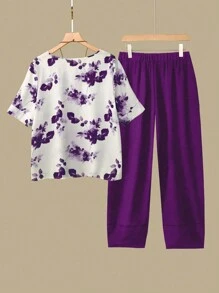 Linhara Women's Plus Size Floral Print Round Neck Short Sleeve Top And Elastic Waist Crossover Hem Pants Set, For Summer