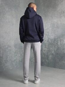 SUMWON طقم قطعتين من هودي ضيق الملبس من الأعلى وبنطلون جوجر بلون متباين مع طباعة رسومية صغيرة