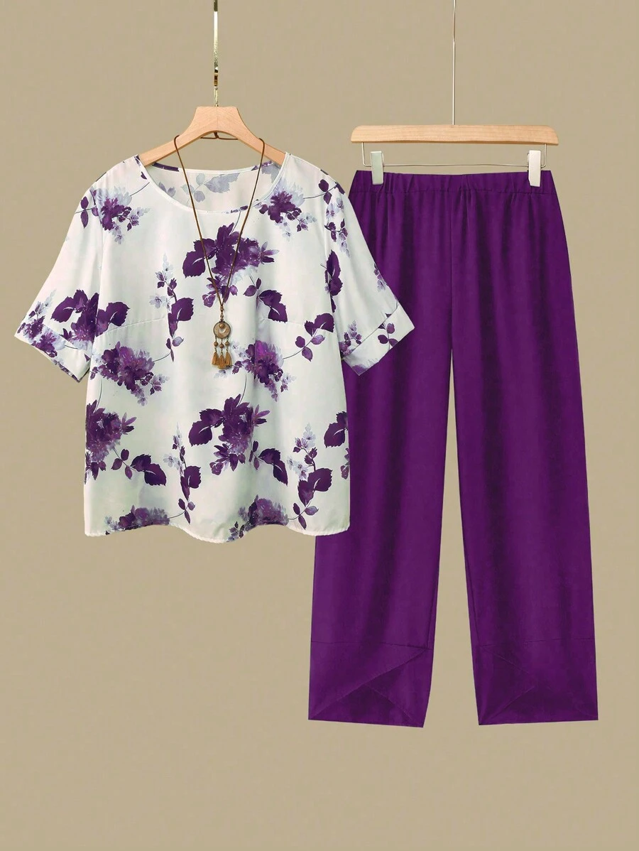 Linhara Women's Plus Size Floral Print Round Neck Short Sleeve Top And Elastic Waist Crossover Hem Pants Set, For Summer