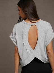 SHEIN Essnce Women's Solid Color Round Neck Hollow Out Short Front Long Back Summer T-Shirt