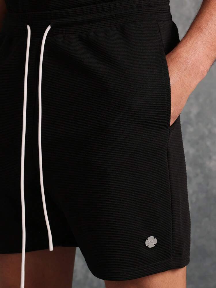 Conjunto esencial de camiseta de tirantes y pantalones cortos texturizados