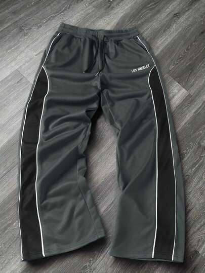 Manfinity EMRG Męskie spodnie dresowe z nadrukiem w litery, ściągaczem w pasie i szerokimi nogawkami, idealne na imprezę Rave