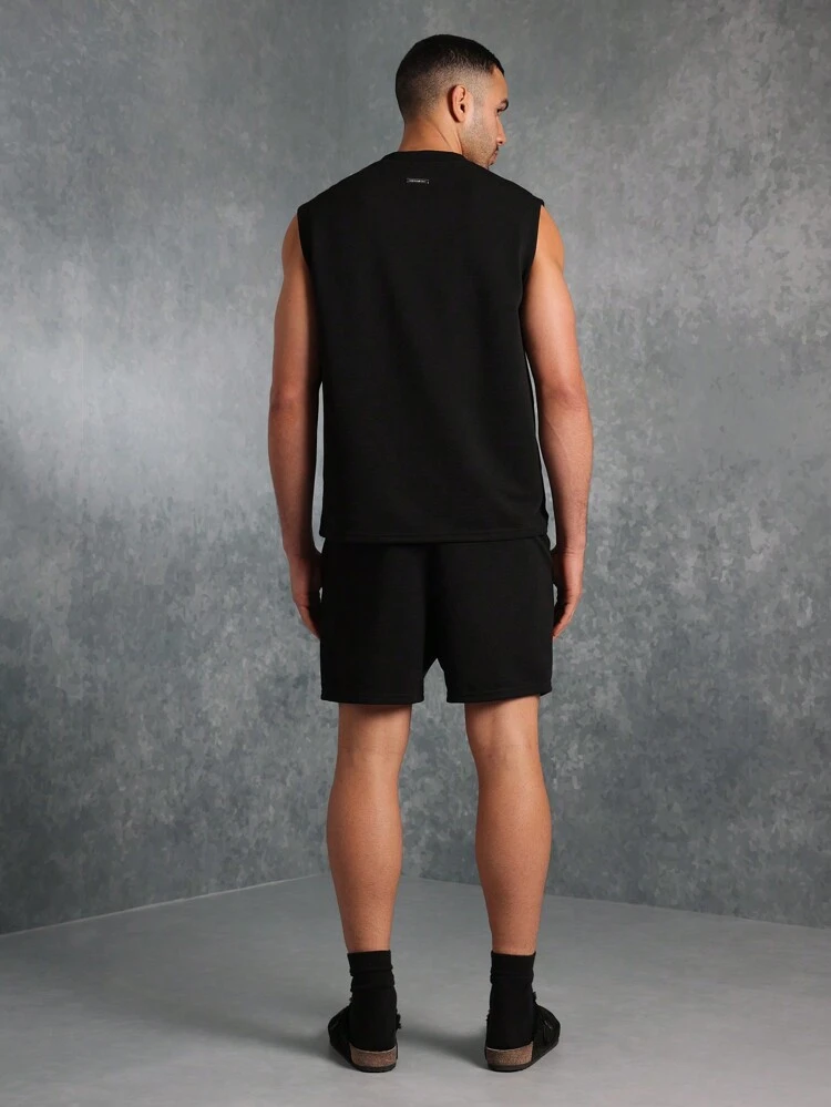 Conjunto esencial de camiseta de tirantes y pantalones cortos texturizados
