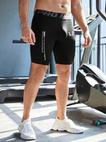 Manfinity Fitness Men's Slogan Print Athletic Compression Shorts