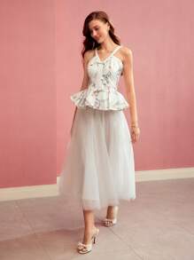 MOTF PREMIUM TOP Z PEPLUM I NADRUKIEM W KWIATOWE KOLORY BEZ RĘKAWÓW
