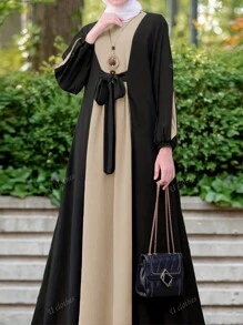 Nuovo vestito casual con collo rotondo, colore a blocchi nella parte anteriore, cinghia centrale, polsini elastici, maniche lunghe, stile a trapezio, modesto