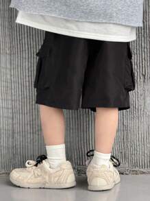 SHEIN Quần short Cargo rộng rãi màu trơn đơn giản cho bé trai có túi lớn, cạp chun, quần đen tối giản đa năng thích hợp mặc đi học, tiệc sinh nhật, biểu diễn, đám cưới, lễ rửa tội, khai giảng, mặc hàng ngày, mùa xuân và mùa hè - màu đen - Xem 8