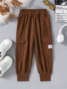 Pantalones jogger de pana con logo para niñas, de moda casual con detalles de bolsillo acordeón, adecuados para uso diario - Café integral - Ver 1