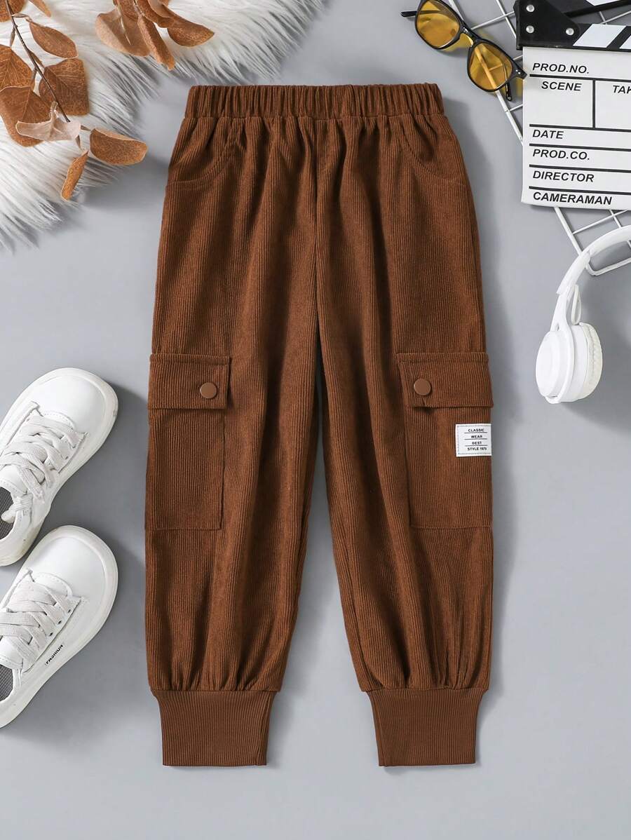 Pantalones jogger de pana con logo para niñas, de moda casual con detalles de bolsillo acordeón, adecuados para uso diario - Café integral - Ver 1
