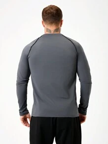 Manfinity Sport Corelite Herren Lässig Fitness & Sport T-Shirt mit rundem Ausschnitt, Raglanärmeln und Buchstaben-Muster, Langarm