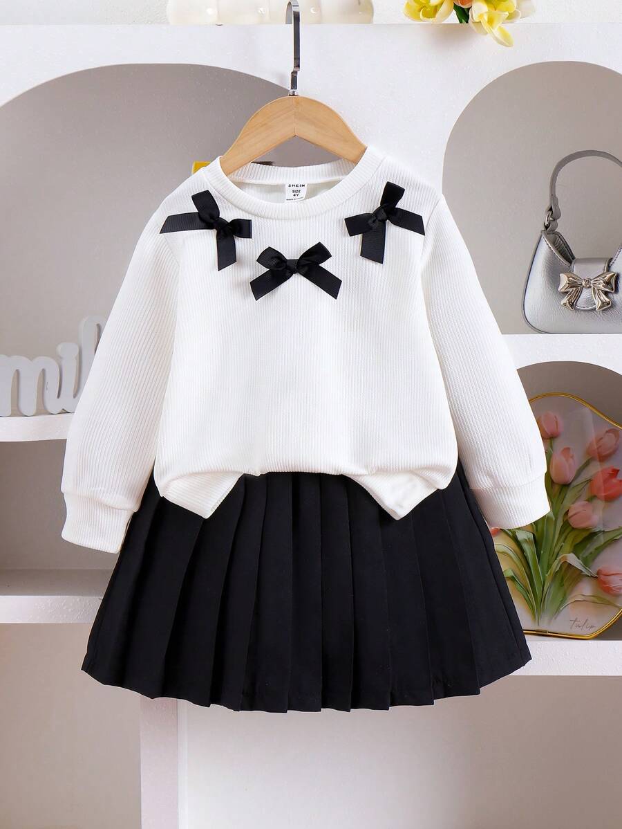 SHEIN Elladie kids 2 件套年轻女孩休闲可爱针织运动衫套装,长袖蝴蝶结上衣和黑色百褶裙,适合秋季假期和日常穿着 - 白色 - 查看 1