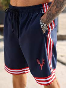 Manfinity Homme Pantalones cortos casuales holgados con bolsillo, cordón de ajuste en la cintura para hombres talla grande con rayas