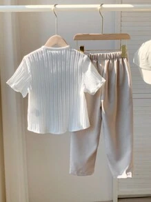 SHEIN Leap Crew 2-Piece Set Of Young Boy Casual Sportswear, Featuring A Vintage, Artistic, Retro, Textured Fabric, Includes A Half-Sleeve Stand-Up Collar T-Shirt And Long Pants Set, Suitable For Back To School,Birthday Parties, Evening Events, Performances - White - View 4