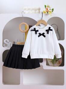 SHEIN Elladie kids 2 件套年轻女孩休闲可爱针织运动衫套装，长袖蝴蝶结上衣和黑色百褶裙，适合秋季假期和日常穿着 - 白色 - 查看 6