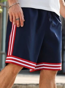 Manfinity Homme Pantalones cortos casuales holgados con bolsillo, cordón de ajuste en la cintura para hombres talla grande con rayas
