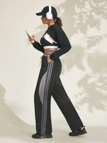 Damen Jogginghose mit Kordelzug an der Taille, seitlichen Streifen und weitem Bein