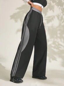 Damen Jogginghose mit Kordelzug an der Taille, seitlichen Streifen und weitem Bein