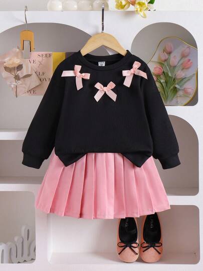 SHEIN 2pcs Young Girl Casual Cute Knitted Sweatshirt Set, Long Sleeve Bow Decor Top And Pink Pleated Skirt, Suitable For Autumn, Holiday And Daily Wear