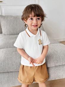 SHEIN 2pcs/Set Cute Cartoon Bear Print Lapel Short Sleeve Polo T-Shirt And Solid Color Shorts For Baby Boy And Baby Girl, Casual Outfit For Spring And Summer Indoor And Outdoor Wear - Khaki - View 3