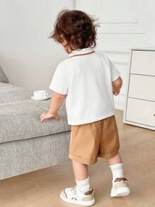 SHEIN 2pcs/Set Cute Cartoon Bear Print Lapel Short Sleeve Polo T-Shirt And Solid Color Shorts For Baby Boy And Baby Girl, Casual Outfit For Spring And Summer Indoor And Outdoor Wear - Khaki - View 2