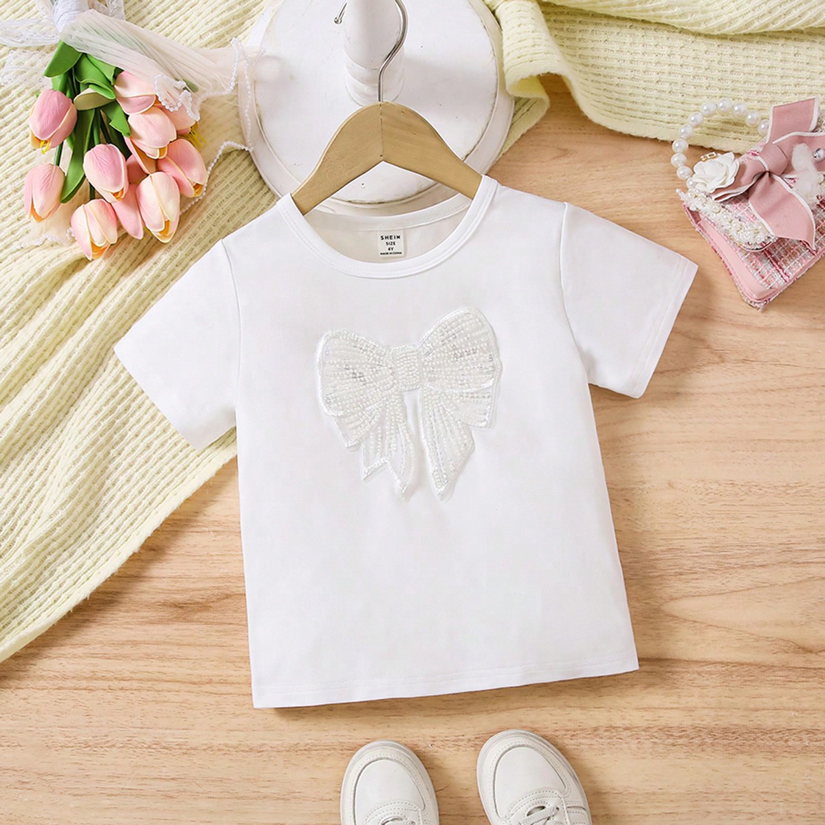 Camiseta de manga corta con cuello redondo y bordado de lazos, casual y linda, versátil para el verano, para niñas jóvenes