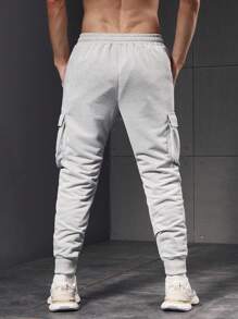 Manfinity Sport PWRUP Pantalon de sport pour hommes à taille élastique et liens aux chevilles, minimaliste et décontracté