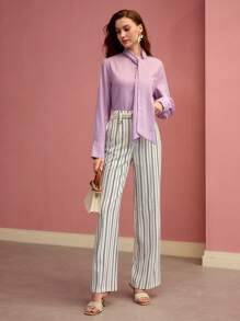 MOTF PREMIUM Pantalones acampanados con bolsillo sesgado a rayas
