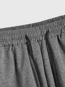 Manfinity EMRG Pantalones cortos holgados para hombres con cordón en la cintura y gráficos de astronauta y letras