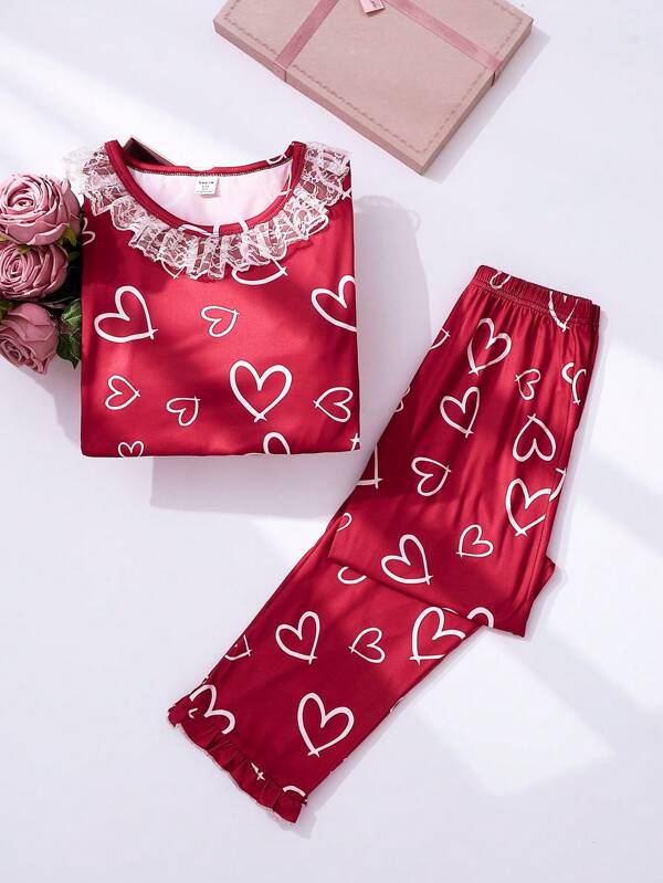 SHEIN Conjunto de pijama de 2 piezas cómodo para navidad para niña preadolescente con pantalón largo y top de manga larga con estampado minimalista de corazones blancos sobre fondo rojo