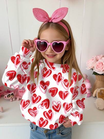 SHEIN Sudadera de manga larga cómoda de punto para niñas jóvenes, de ajuste relajado y cuello redondo, con estampado de corazones pintados a mano en rosa y rojo para el Día de San Valentín