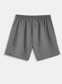 Manfinity EMRG Pantalones cortos holgados para hombres con cordón en la cintura y gráficos de astronauta y letras