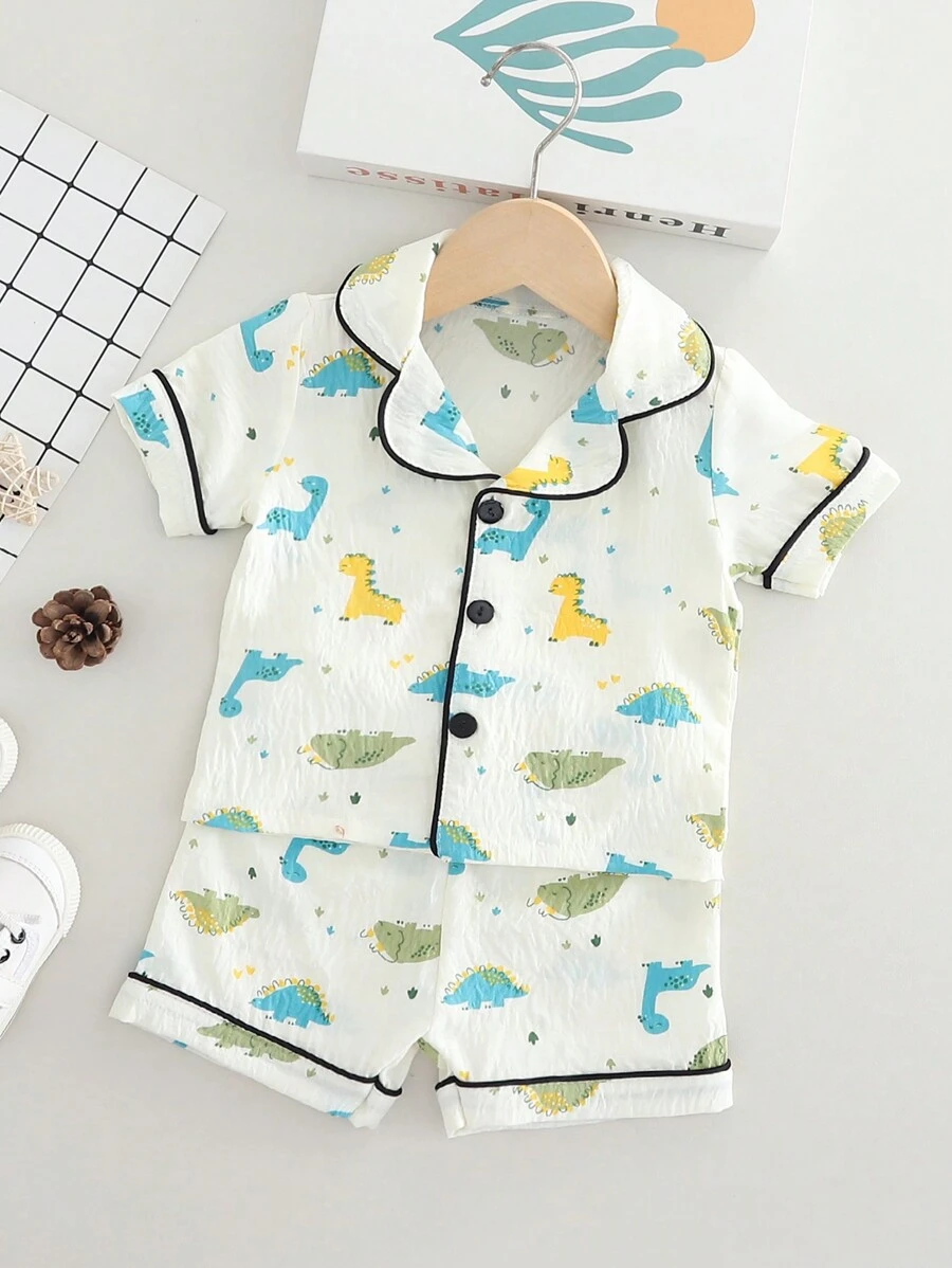 SHEIN 2 件装幼儿男童休闲恐龙印花短袖上衣和短裤家居套装，舒适 - 米色 - 查看 1