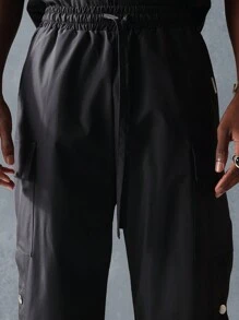 SUMWON Nylon Flare Fit Cargo Pants With Snap Details, Streetwear Athletic Technical Pants, Urban Style Workwear Bottoms, Utility Performance Pants