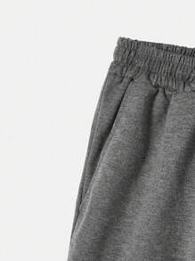 Manfinity EMRG Pantalones cortos holgados para hombres con cordón en la cintura y gráficos de astronauta y letras