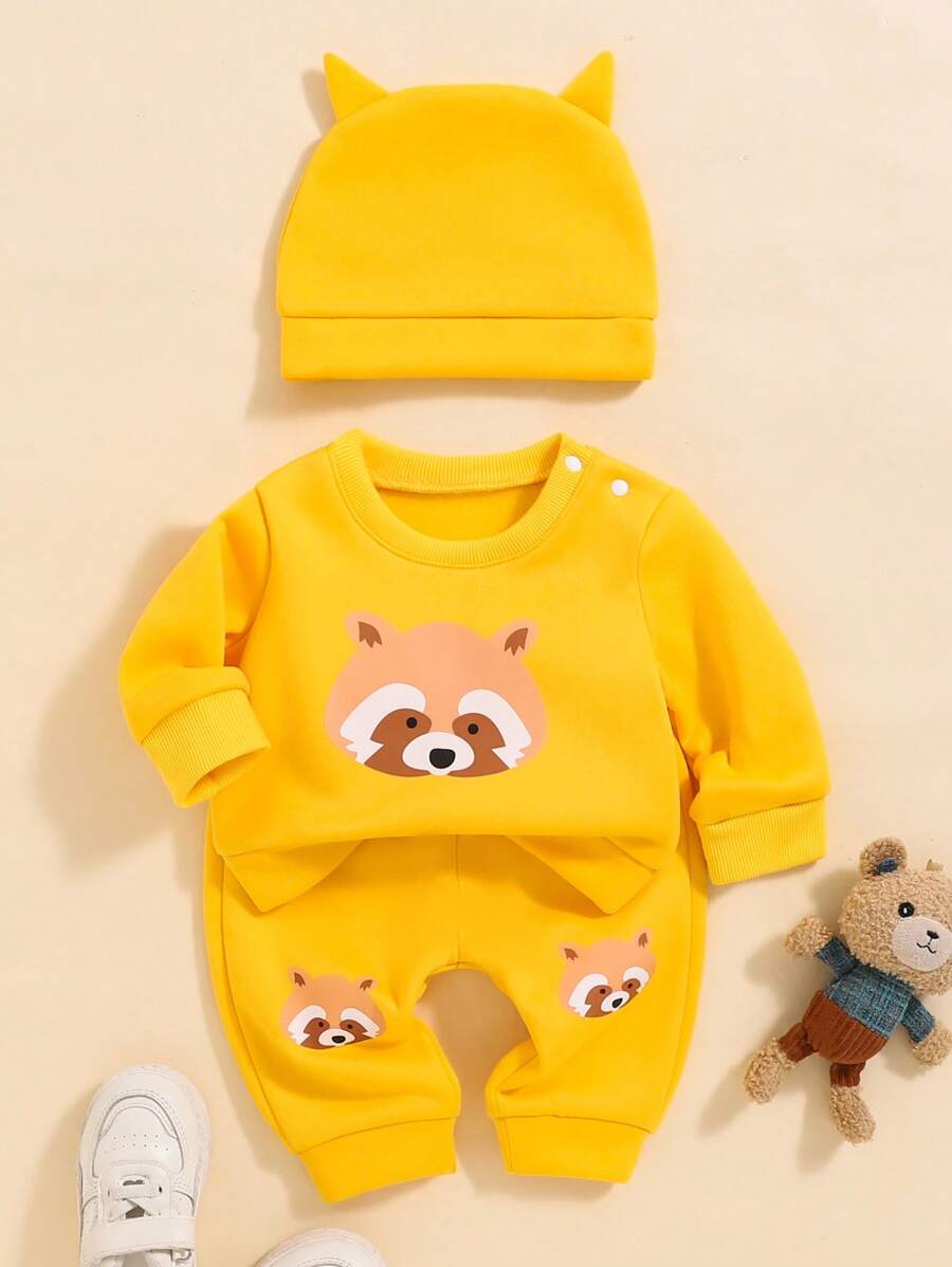 SHEIN Playful Pals This Newborn Baby Boy Cartoon Raccoon Graphic Set Includes 1 Top And 1 Pants, Designed With Adorable Raccoon Pattern, Made Of Quality Fabric With Thoughtful Details. Whether For Everyday Wear Or Special Occasions, This Set Provides Comfort And Style For Your Baby. - Yellow - View 1