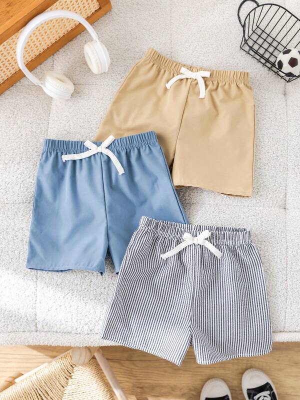 SHEIN Acquista due e ottieni un pacchetto da tre gratis di pantaloncini casual sportivi retrò a righe e di colore unito, adatti per look da ragazzo, abiti per bambini e ragazzi, adatti per feste di compleanno, serate, eventi, matrimoni, battesimi, cerimonie di apertura, utilizzo quotidiano, scuola, viaggi, sport, adatti per primavera ed estate