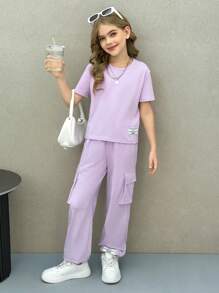 SHEIN Conjunto de top de manga corta de cuello redondo y pantalones de chándal informales para niñas preadolescentes