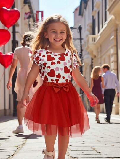 SHEIN Conjunto de 2 piezas para niña: Camiseta de cuello redondo de manga corta con estampado de corazón y falda roja de malla con lazo, ideal para San Valentín, bodas, fiestas, vacaciones, elegante