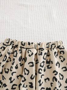 Cozy Pixies Conjunto de ropa de 2 piezas para niña bebé con top de manga acampanada con volantes y cuello de gran moño de color contrastante, y falda estilo evasé con estampado de leopardo - Negro - Ver 6