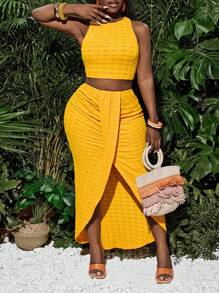Slaydiva Nieuwe lente en zomer casual vakantie ronde hals mouwloos cropped vest + midden voorkant overlappende geplooide hoge split tot dij boog zoom asymmetrische zoom rok gele textuur stof dames tweedelige set